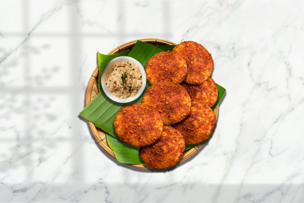 Crispy adai pancakes served with coconut chutney on a banana leaf for an authentic South Indian meal.